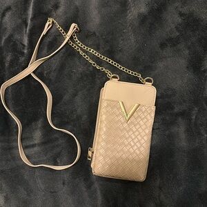 Small tan colored cross body bag
